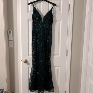 Beautiful beaded emerald green floor length dress. Worn once. Size 4.